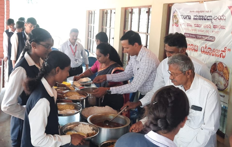 Meals being served to students under the college midday meal scheme