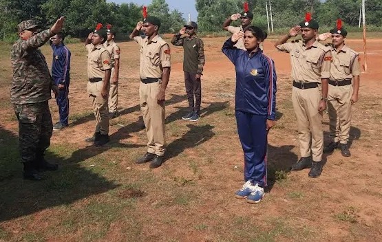 NCC cadets practising saluting under an instructor's guidance