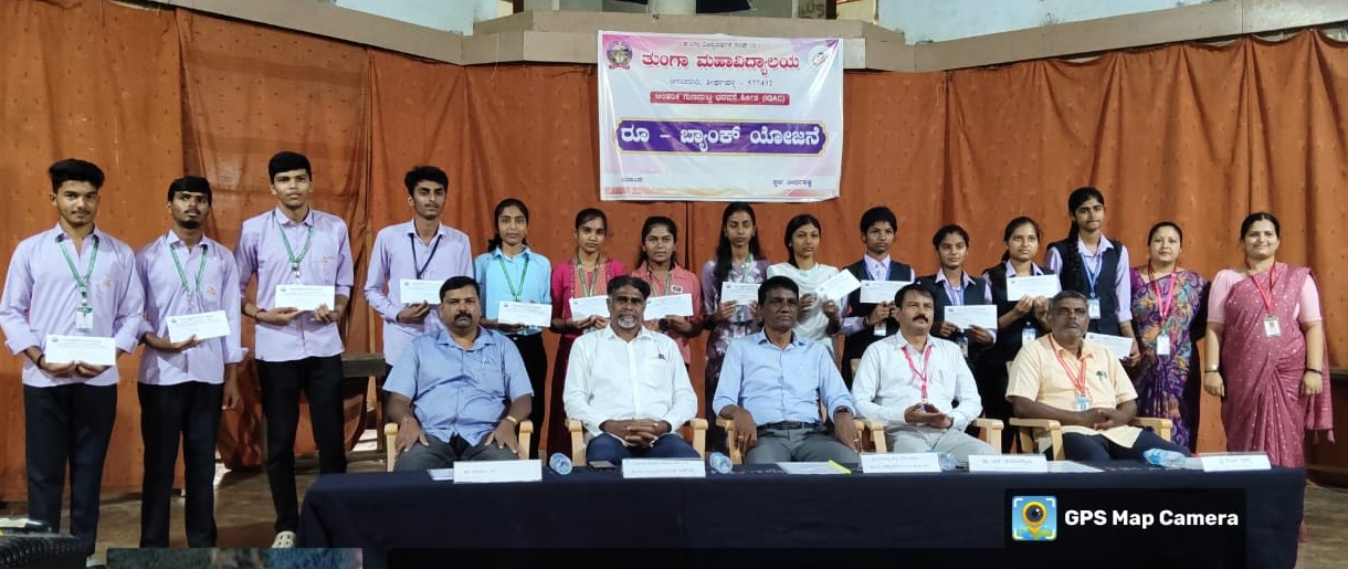 Students holding financial assistance cheques with guests at the RU-Bank programme, Tunga Mahavidyalaya, 14 October 2025
