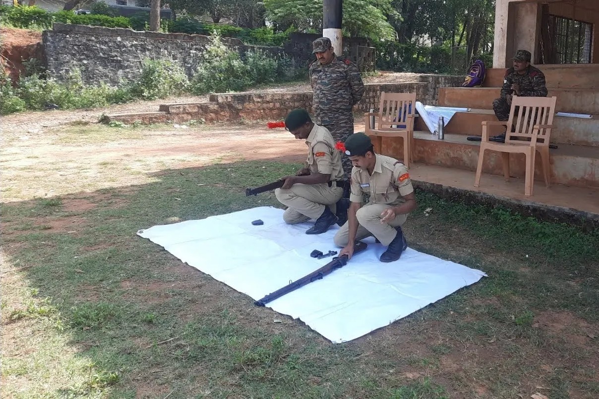 NCC cadets with rifles during supervised training